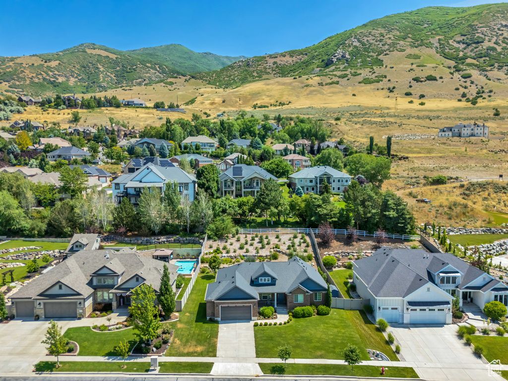 Aerial perspective of suburban area with a mountain backdrop
