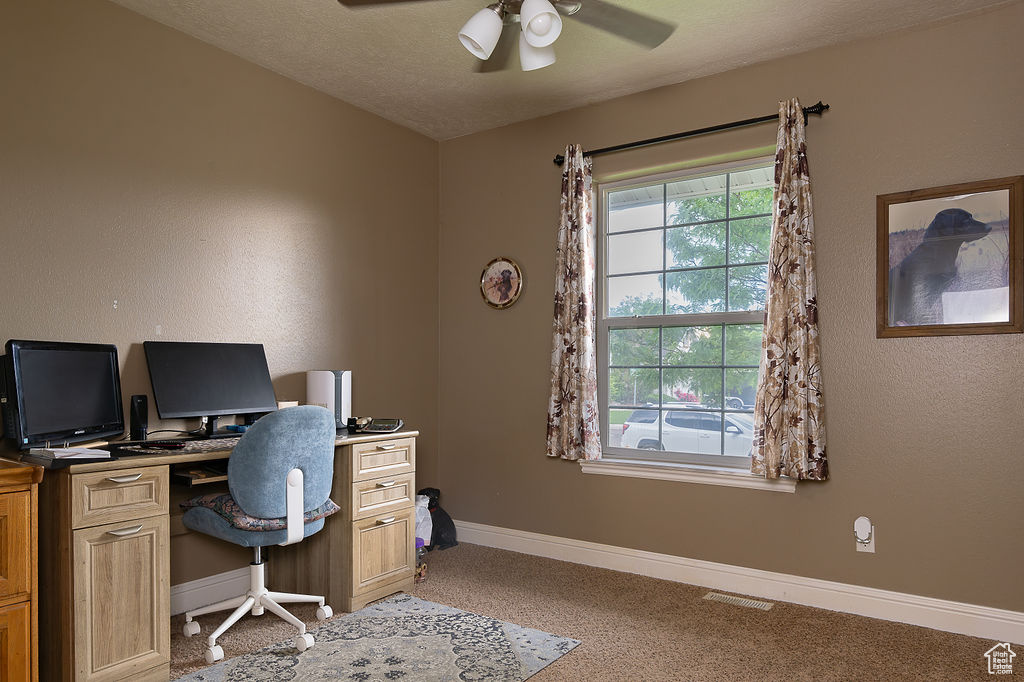 Office featuring ceiling fan and light carpet