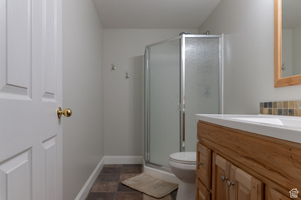 Full bathroom with vanity and a shower stall