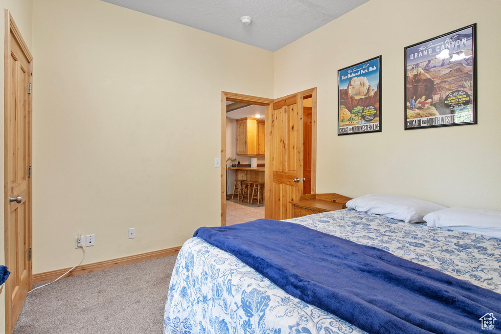Bedroom with carpet and baseboards