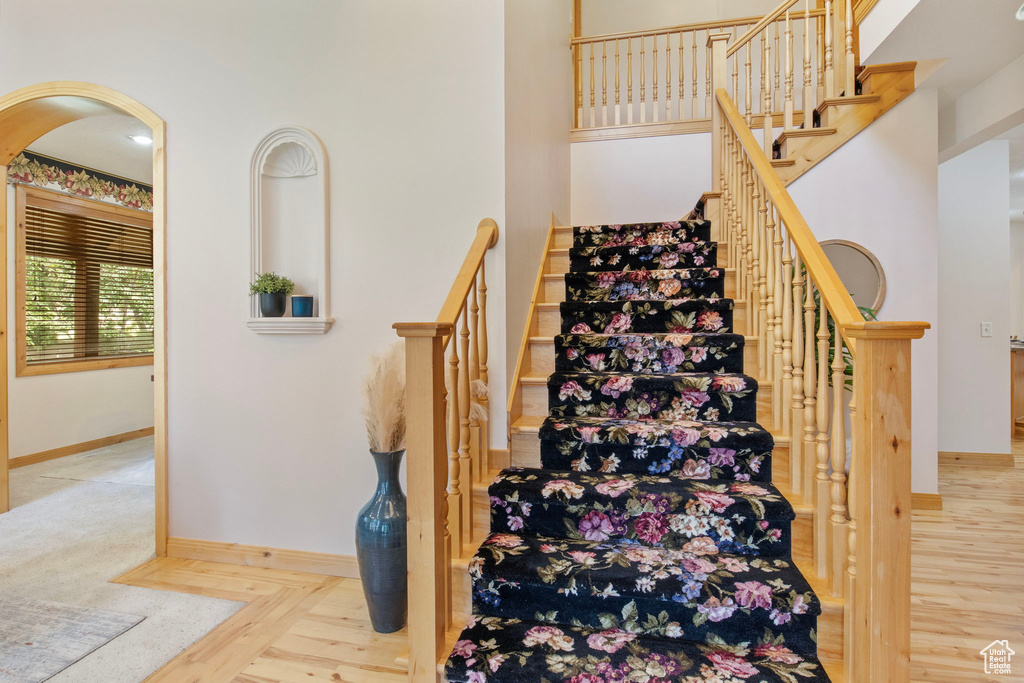 Stairway featuring baseboards