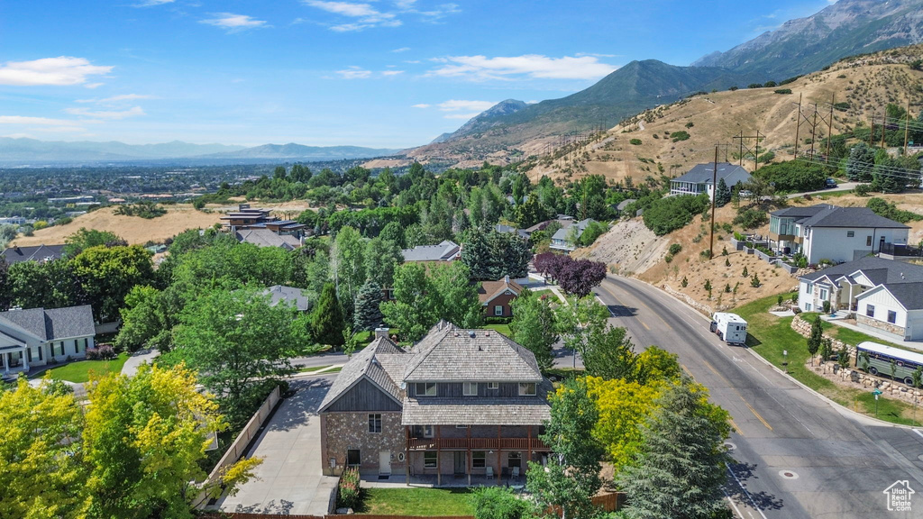 Aerial perspective of suburban area with a mountainous background