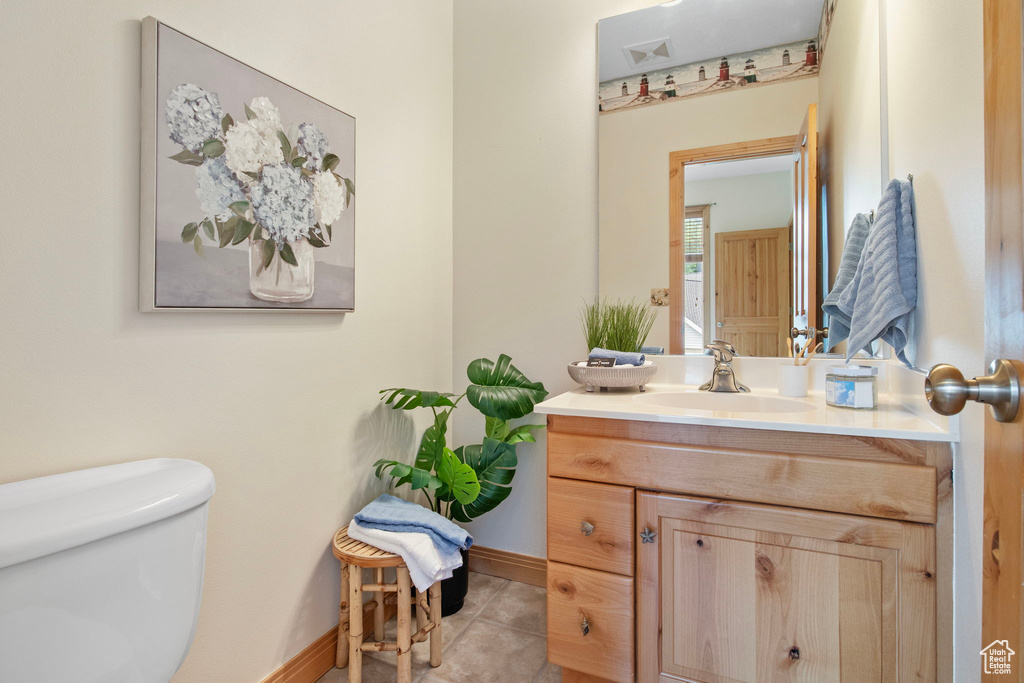 Bathroom featuring vanity and tile patterned flooring
