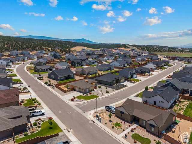 Aerial view of residential area featuring a mountainous background