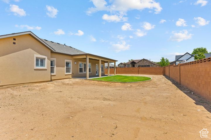 Fenced backyard featuring a patio area