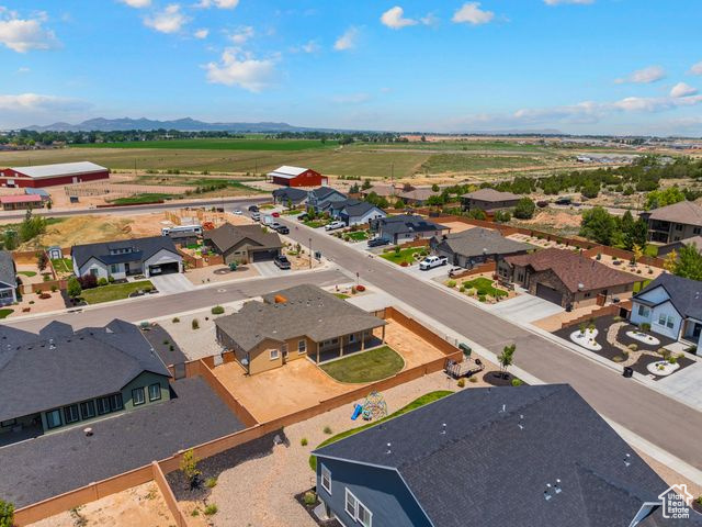 Aerial view of residential area featuring a mountain backdrop