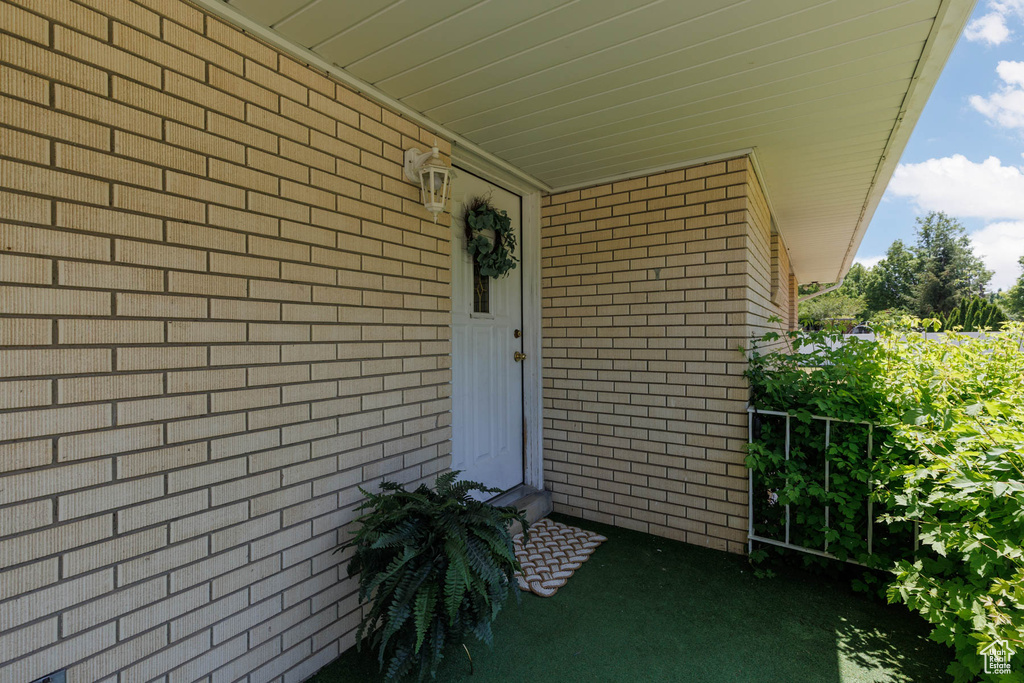 Property entrance with brick siding