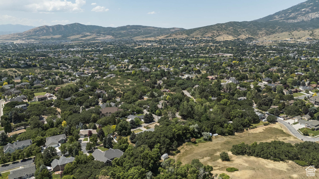 Aerial view of property and surrounding area with mountains