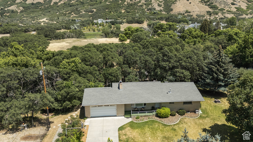 View of subject property featuring a forest