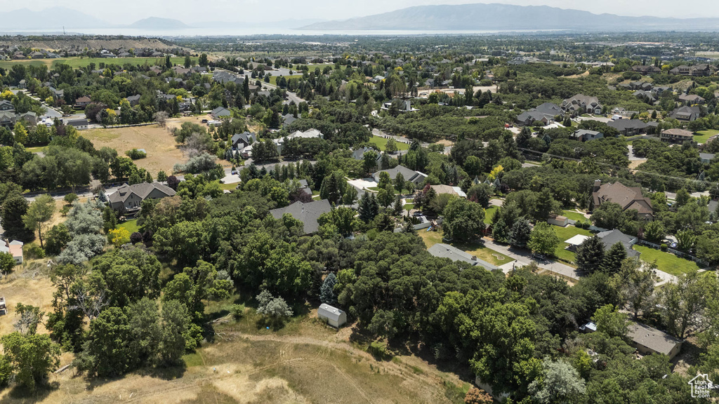Aerial overview of property\\\'s location featuring mountains and nearby suburban area