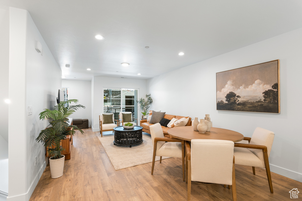 Dining space featuring light wood-style floors and recessed lighting