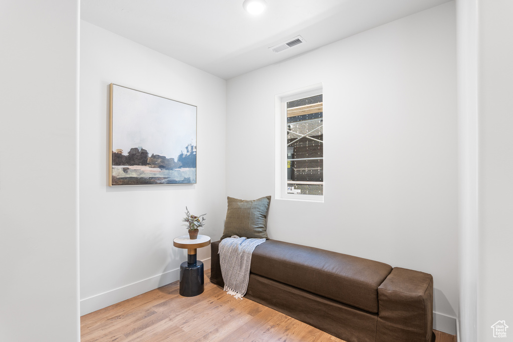 Sitting room featuring wood finished floors and baseboards
