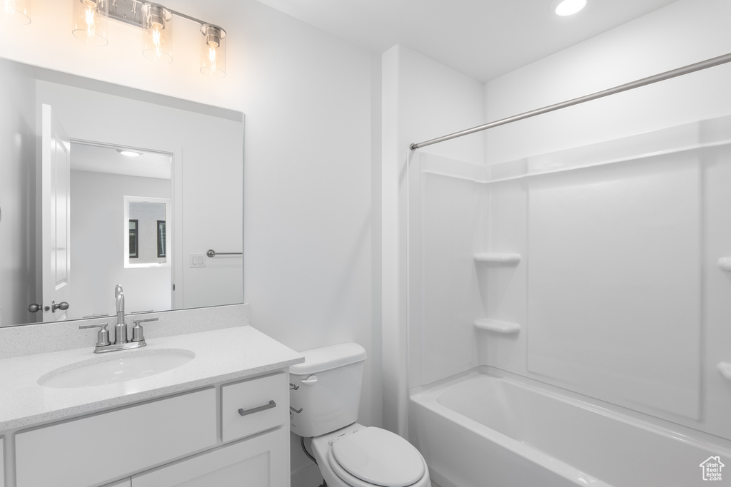 Full bath featuring vanity, shower / bath combination, and recessed lighting