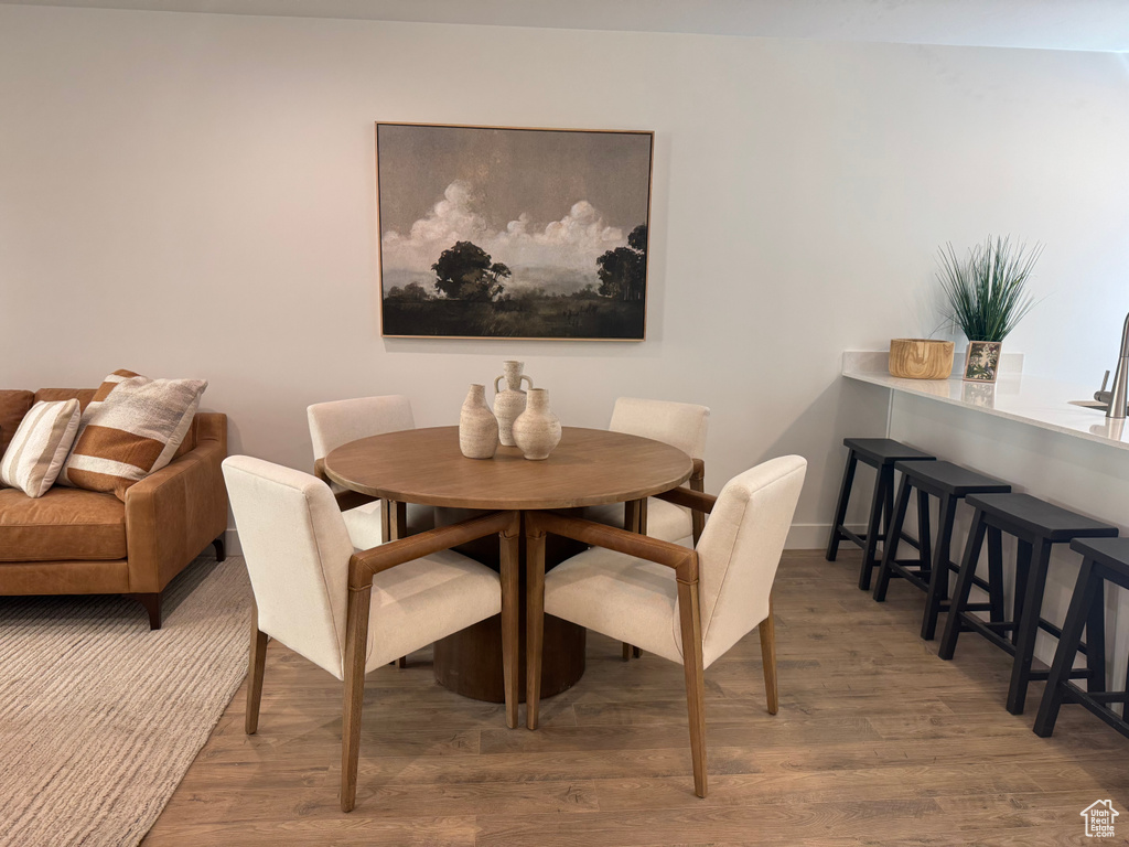 Dining area with wood finished floors