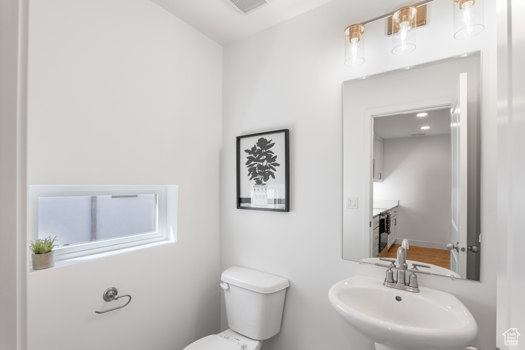 Bathroom featuring toilet and a sink