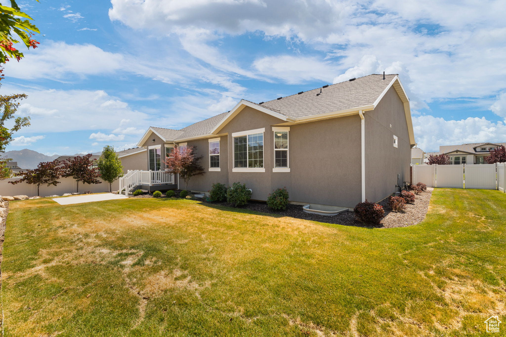 View of home\\\'s exterior with stucco siding and a shingled roof