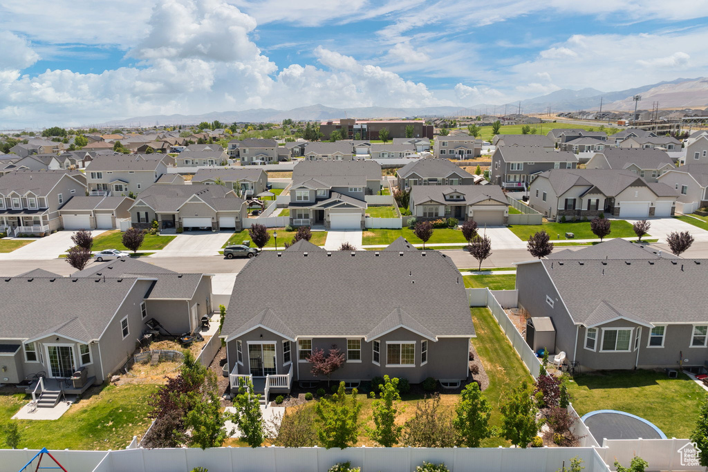 Aerial view of residential area featuring a mountainous background