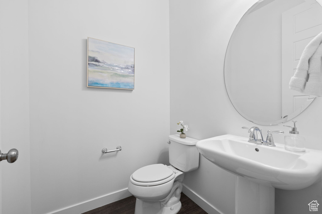 Bathroom featuring wood finished floors and baseboards