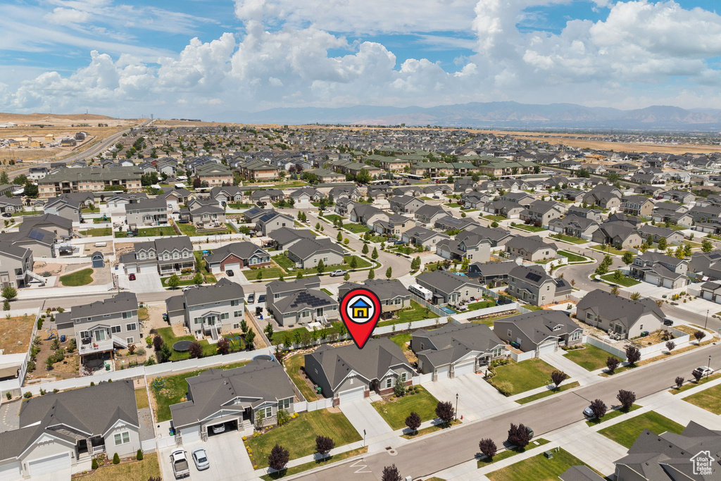 Aerial view of residential area with a mountainous background