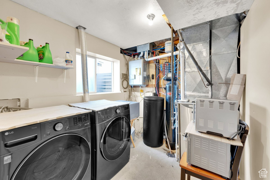 Laundry area with washing machine and dryer and electric panel