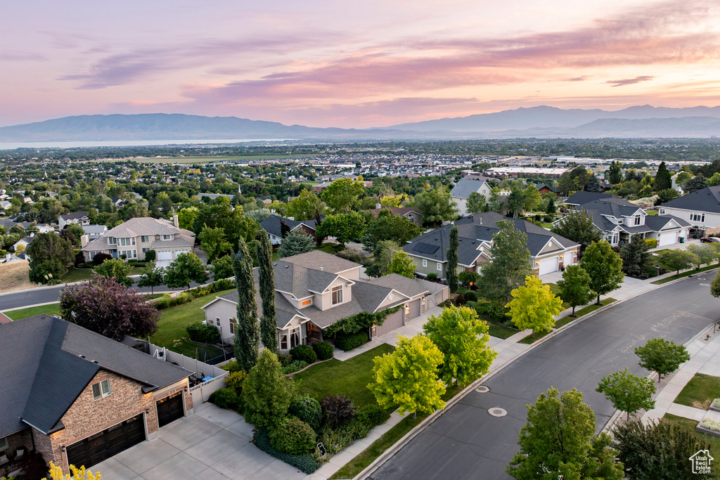 Aerial view of residential area featuring mountains