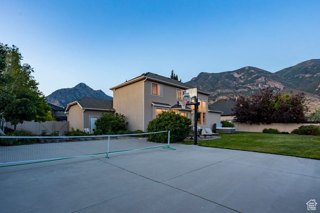 View of front of property with a mountain view and stucco siding