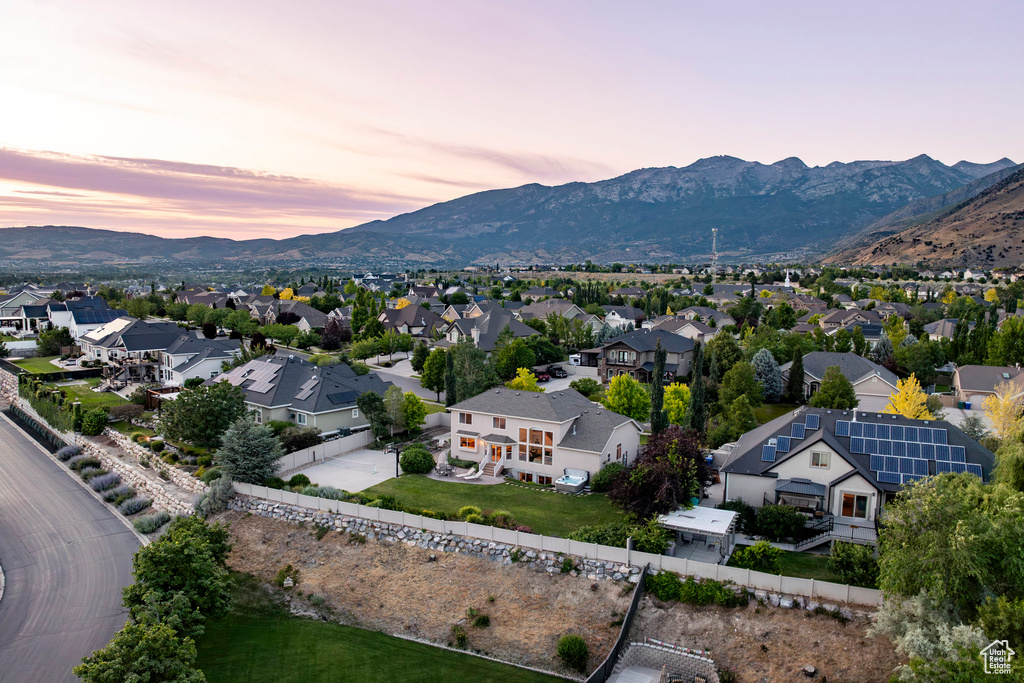 Aerial perspective of suburban area featuring a mountain backdrop