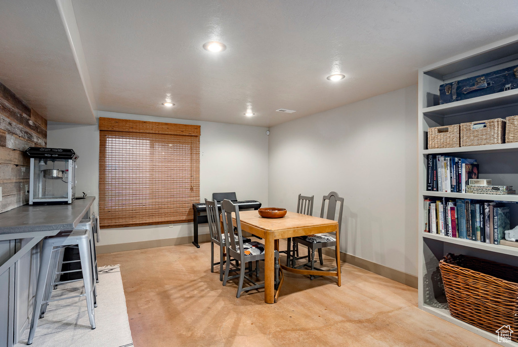 Dining space featuring baseboards and recessed lighting