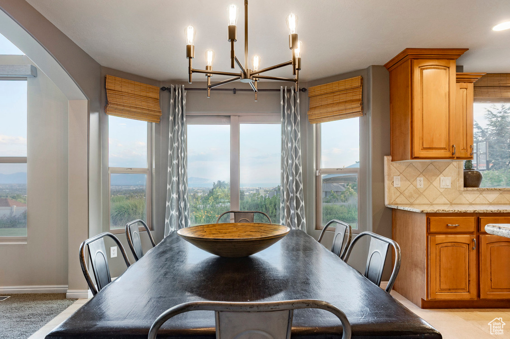 Dining room featuring a chandelier and arched walkways