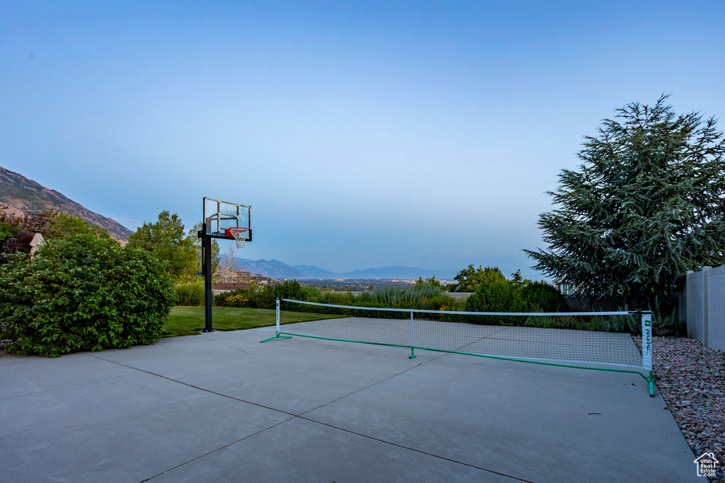 View of sport court featuring a mountain view and volleyball court