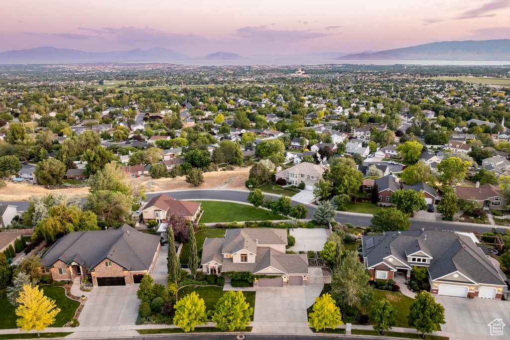 Aerial perspective of suburban area with a mountain backdrop