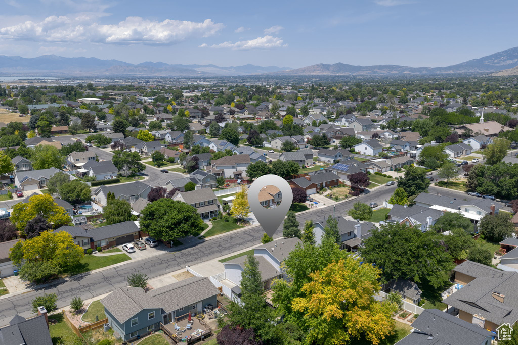 Aerial perspective of suburban area featuring a mountainous background