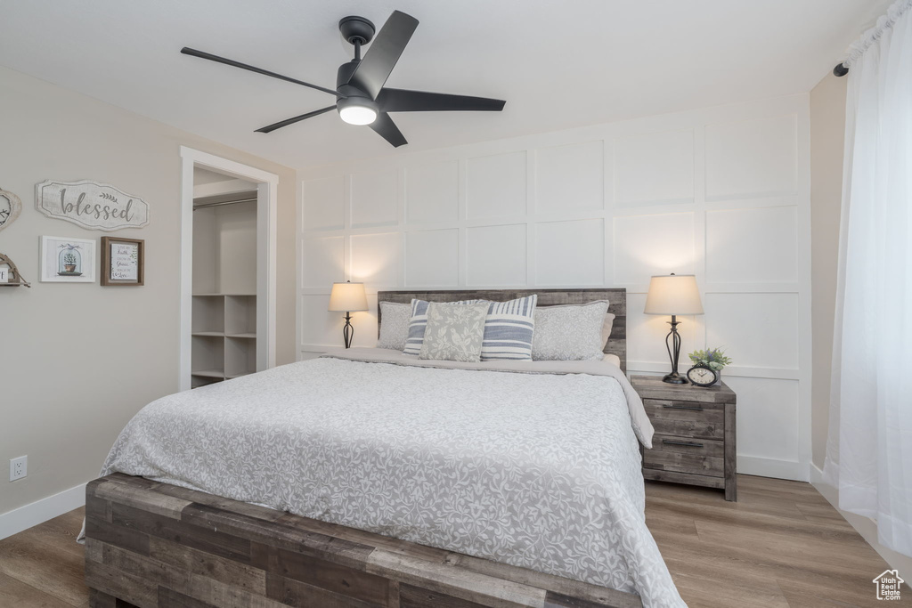 Bedroom featuring wood finished floors and ceiling fan
