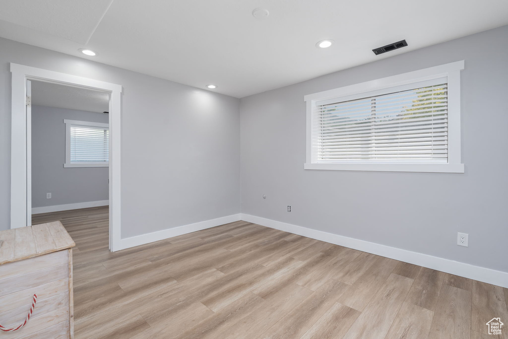 Unfurnished room featuring light wood-style floors and recessed lighting