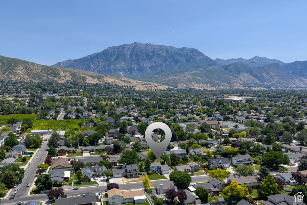 Aerial view of residential area featuring a mountainous background
