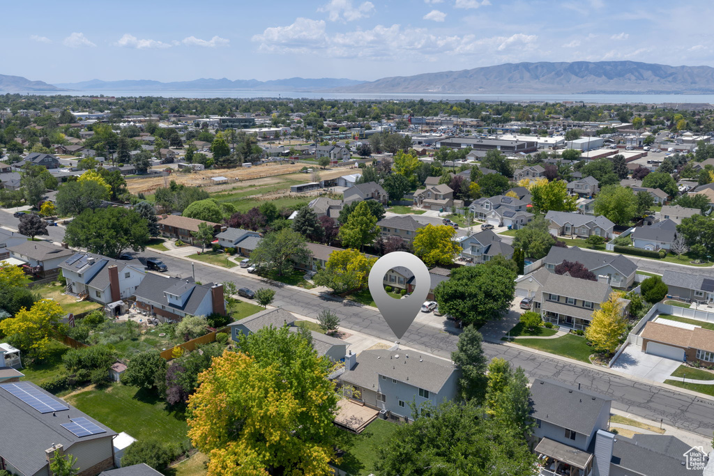 Aerial perspective of suburban area with a mountainous background