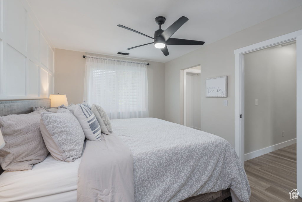 Bedroom featuring wood finished floors and ceiling fan