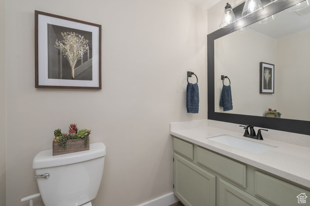 Half bath with toilet and vanity
