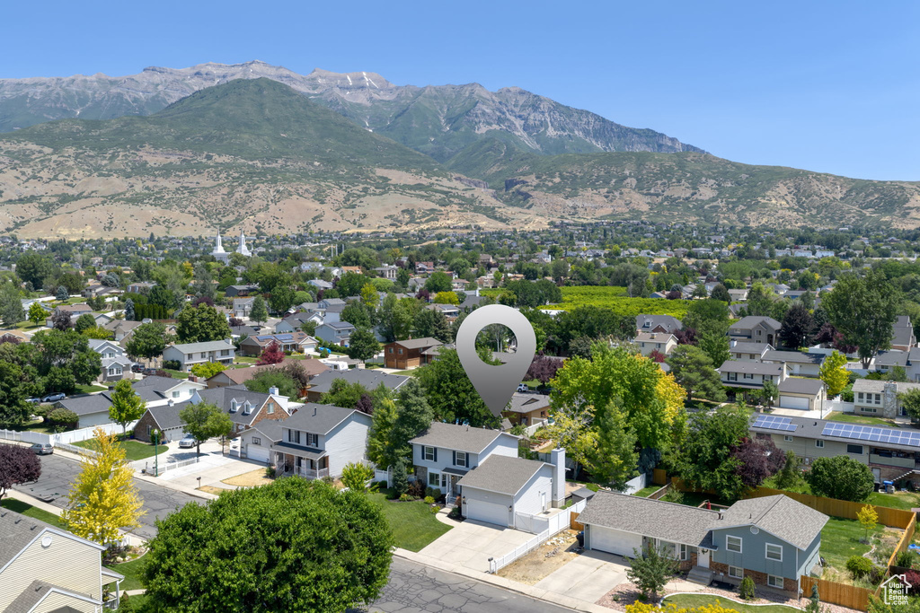 Aerial perspective of suburban area featuring a mountain backdrop