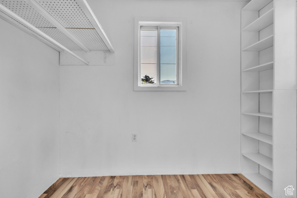 Spacious closet featuring light wood-style floors