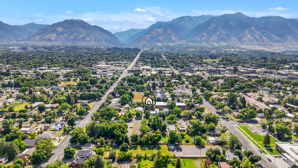 Aerial view of residential area featuring mountains
