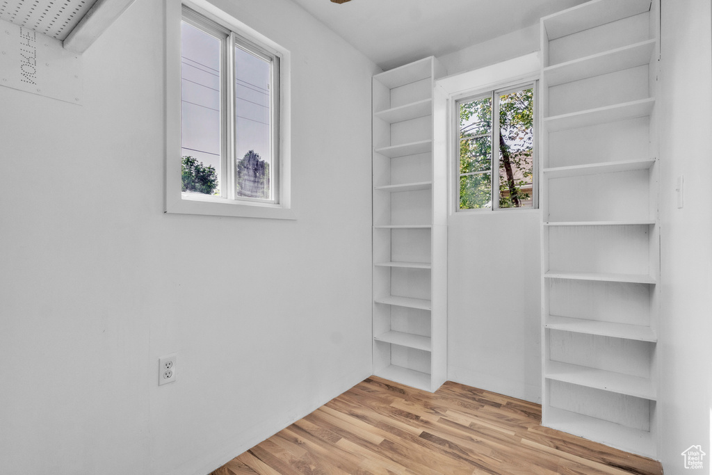 Spacious closet with wood finished floors