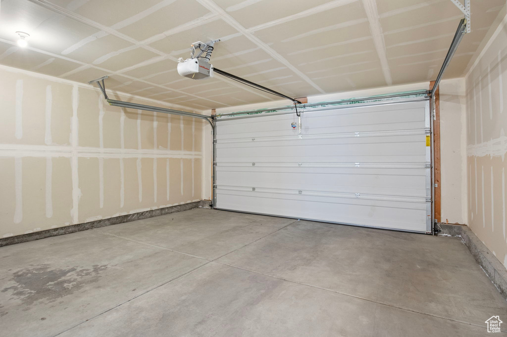 Garage featuring a garage door opener