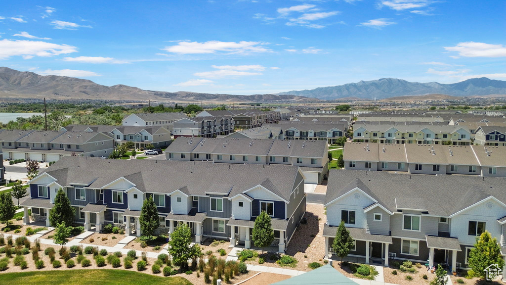 Aerial view of residential area featuring a mountain backdrop