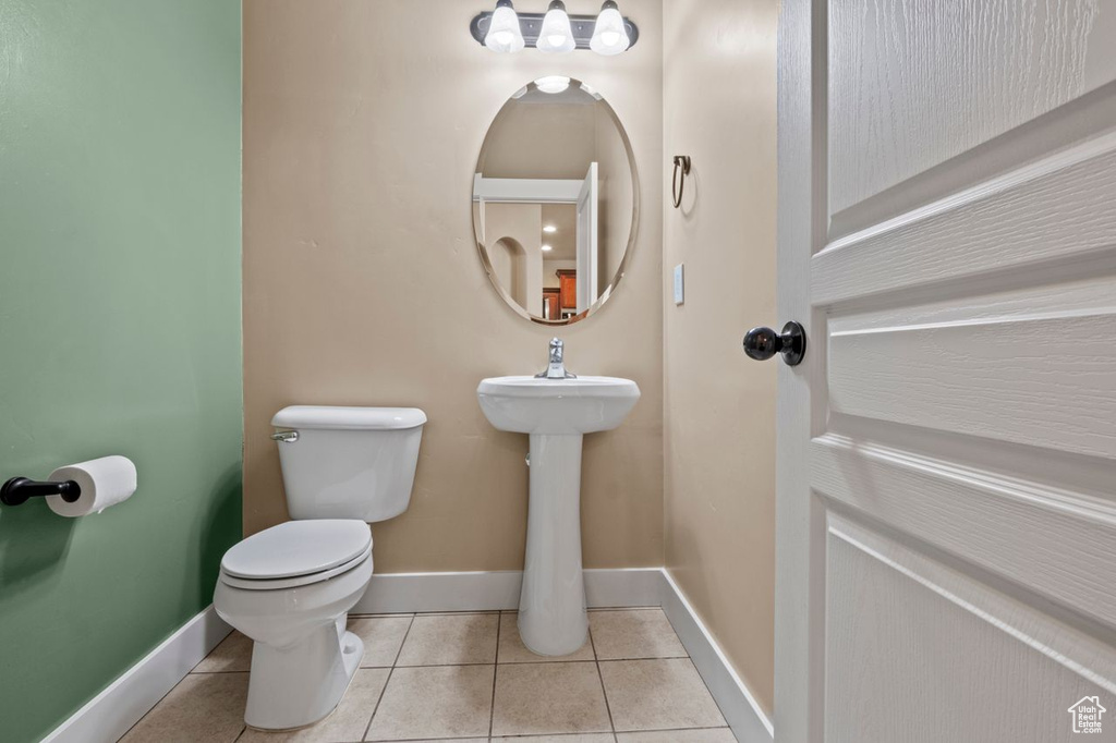Half bath featuring tile patterned flooring