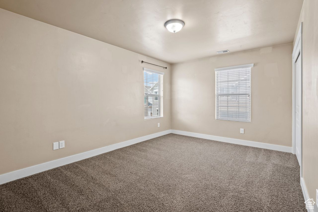 Unfurnished room with carpet floors