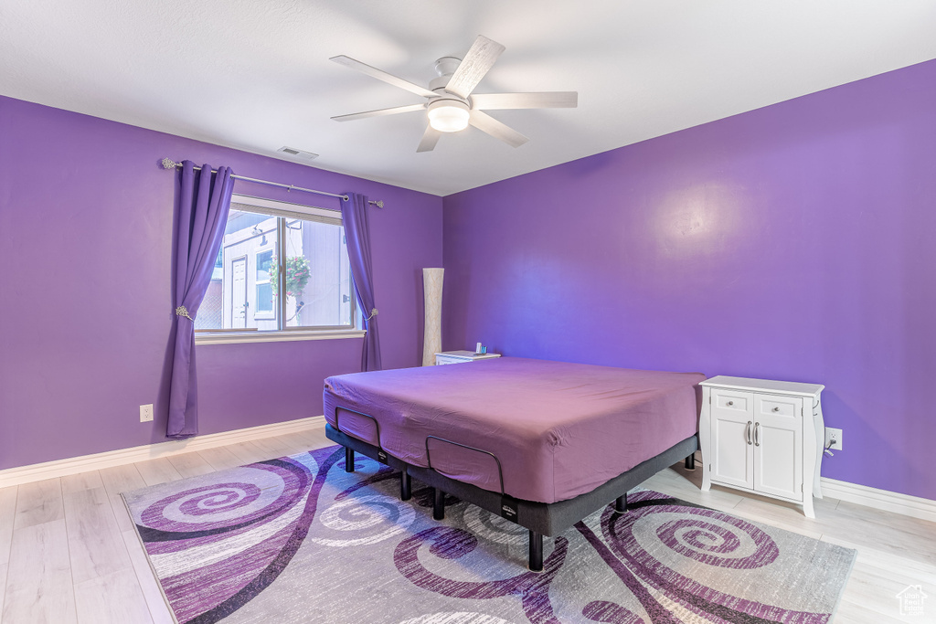 Bedroom with light wood-style flooring and ceiling fan