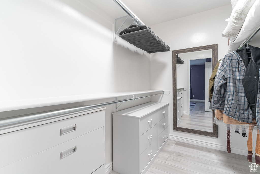 Spacious closet featuring light wood-style floors