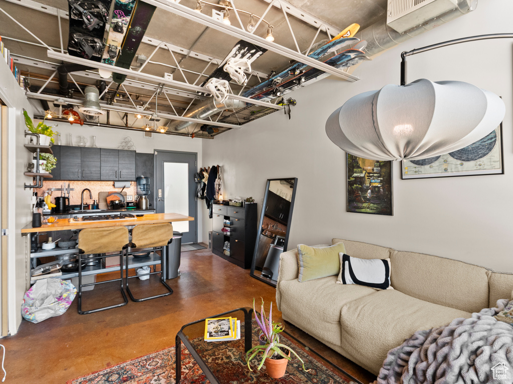 Living area featuring concrete floors