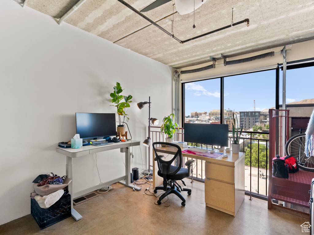 Office space featuring finished concrete floors